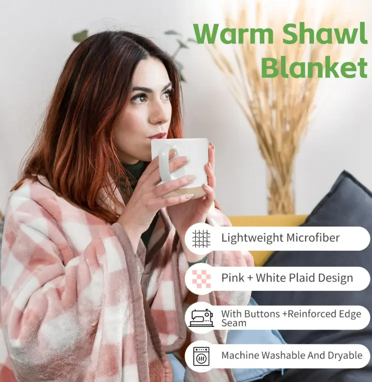Woman wrapped in a pink plaid shawl blanket sipping from a white mug